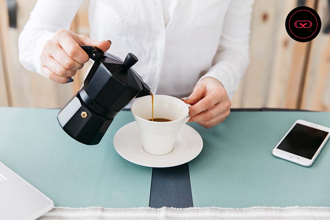 Image of a man pouring coffee